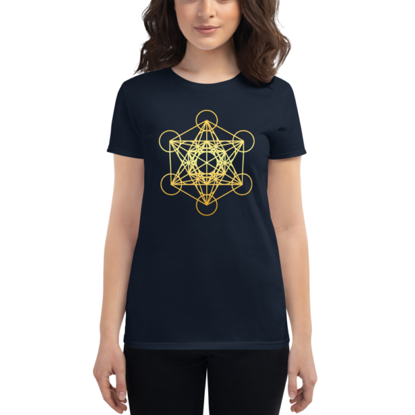 woman wearing dark navy t-shirt with a gradient gold metatron's cube sacred geometry in the front center