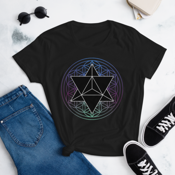 lifestyle photo of t-shirt with a black merkaba and a colored flower of life