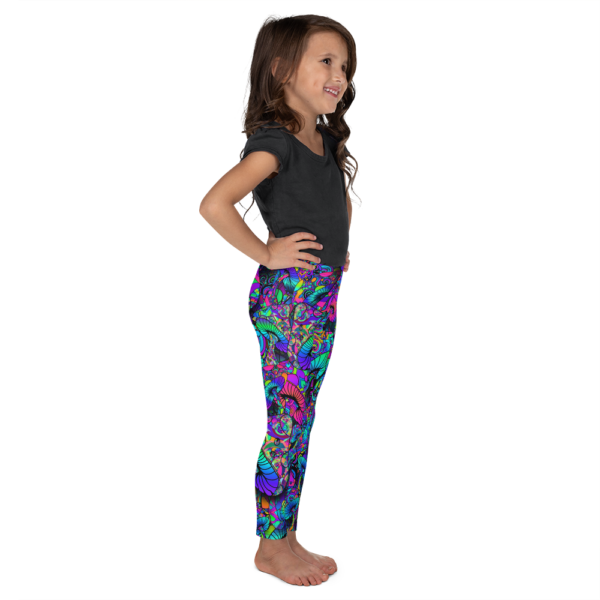 little girl wearing colorful artistic mushroom collage kid's leggings
