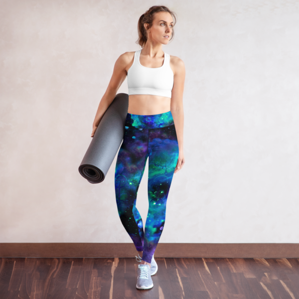 woman wearing yoga leggings with cool colored nebulae and metatron's cube